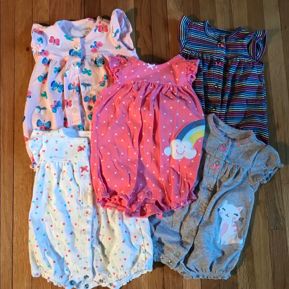 Lot of 5 baby girl rompers from Carters.